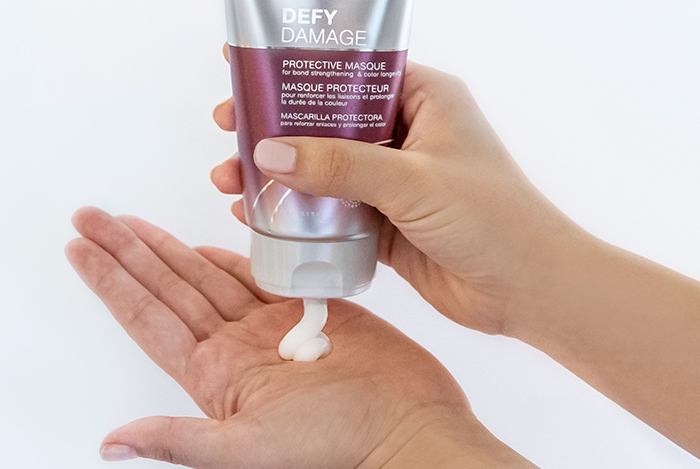 Defy damage masque showing product in hand