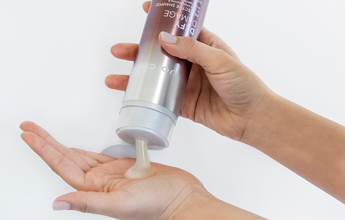 defy-damage-shampoo-in-hand Defy damage shampoo showing product in hand